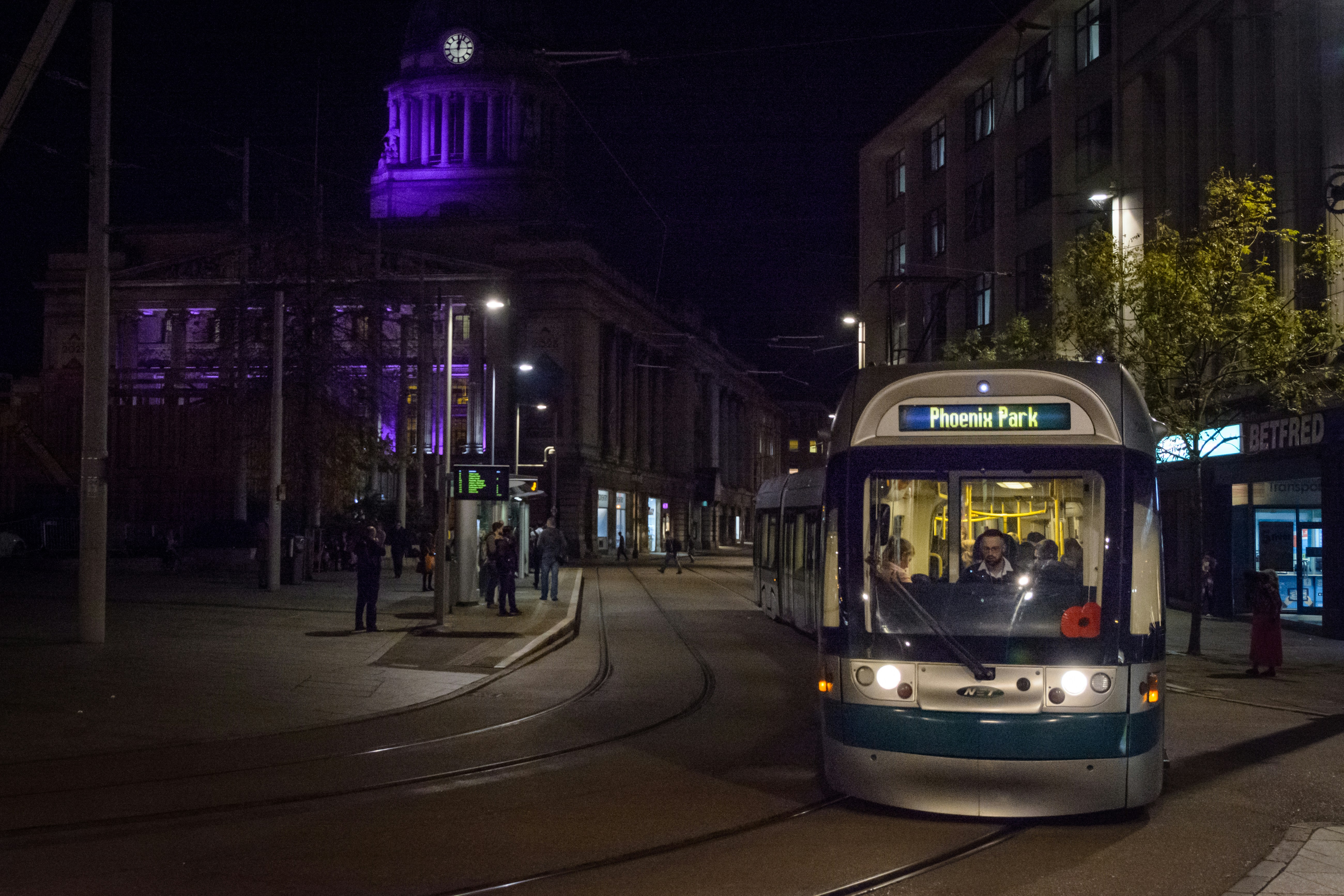 Night view of tram services in Nottingham city near Prime Company.